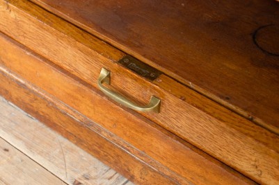 vintage wooden tambour cupboard handle close up
